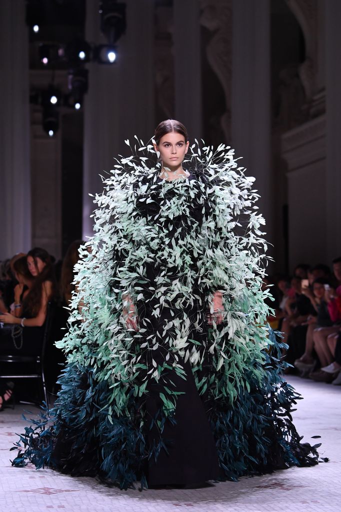 Kaia Gerber walks the runway during the Givenchy Haute Couture Fall/Winter 2019 2020 show as part of Paris Fashion Week  in big feathered gown