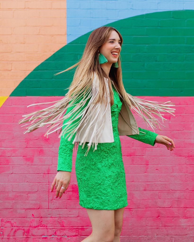 Woman in a fringed green outfit