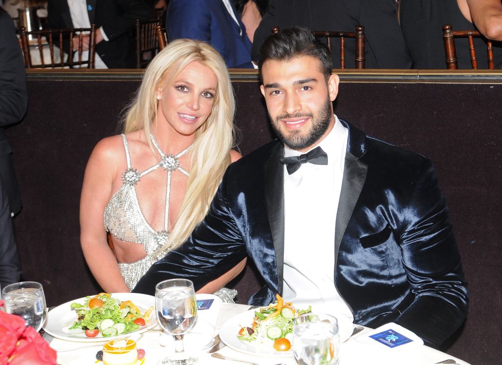 Britney Spears and Sam Asghari sit next to each other at a table as they attend the 29th Annual GLAAD Media Awards at 
