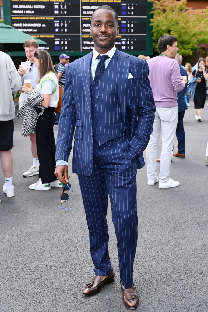 Ncuti Gatwa dressed in navy pinstripe suit