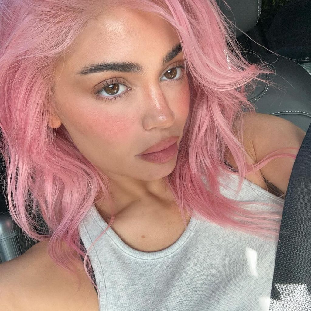 Kylie shows off her bright pink hair