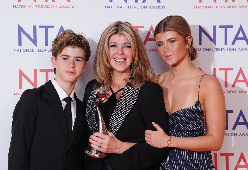 Kate Garraway, winner of the Authored Documentary Award for Derek's Story, with her children Billy (left) and Darcey (right) at the National Television Awards 