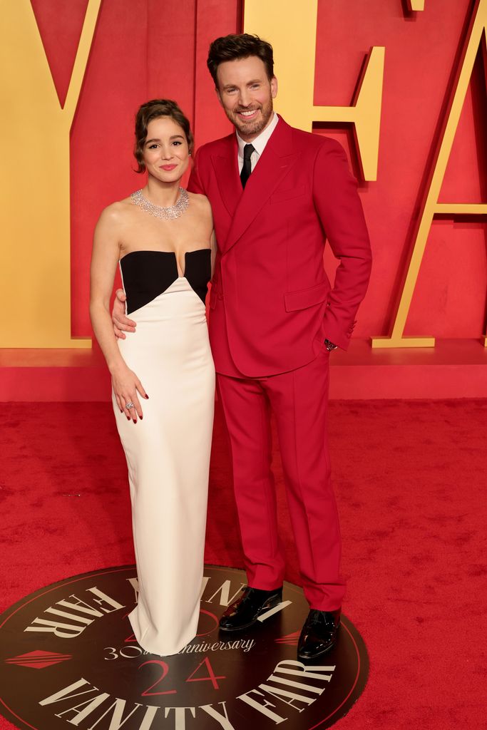 Alba Baptista and Chris Evans attend the 2024 Vanity Fair Oscar Party Hosted By Radhika Jones at Wallis Annenberg Center for the Performing Arts on March 10, 2024 in Beverly Hills, California