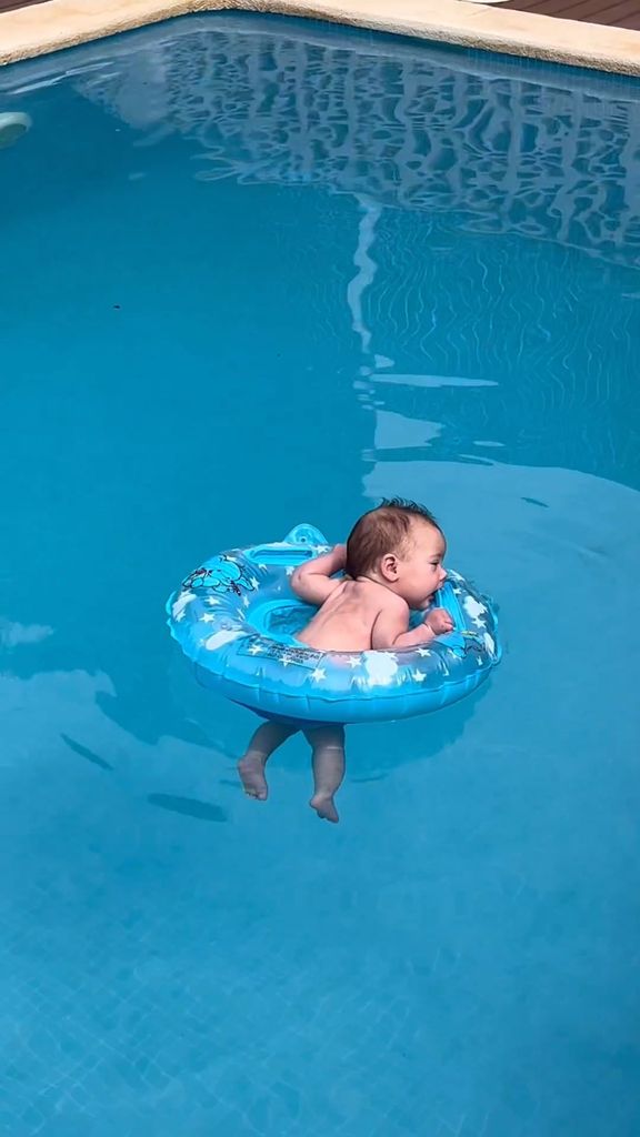 baby nancy using swimming pool ring