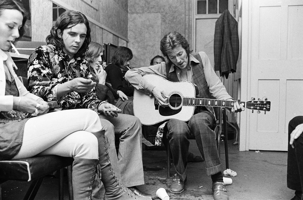 Eric Clapton playing accoustic guitar in the dressing room of Lyceum Ballroom, June 14th, 1970.