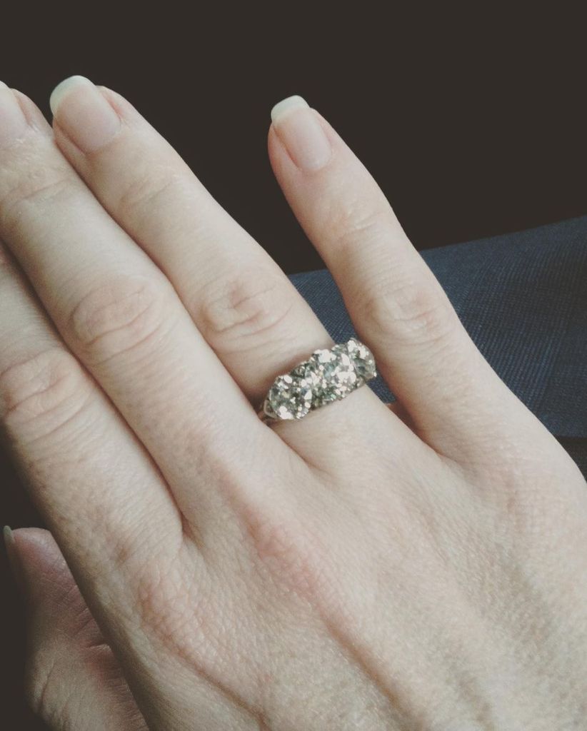 Karen Spencer's hand with her diamond engagement ring