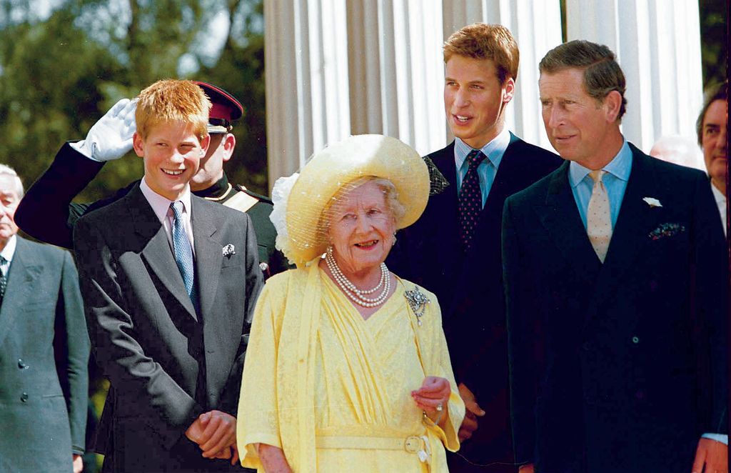 Queen Mum Elizabeth surrounded by great-grandsons Prince Henry (L) and Prince William (2R) and grandson Prince Charles at her 99th birthday celebration at Clarence House