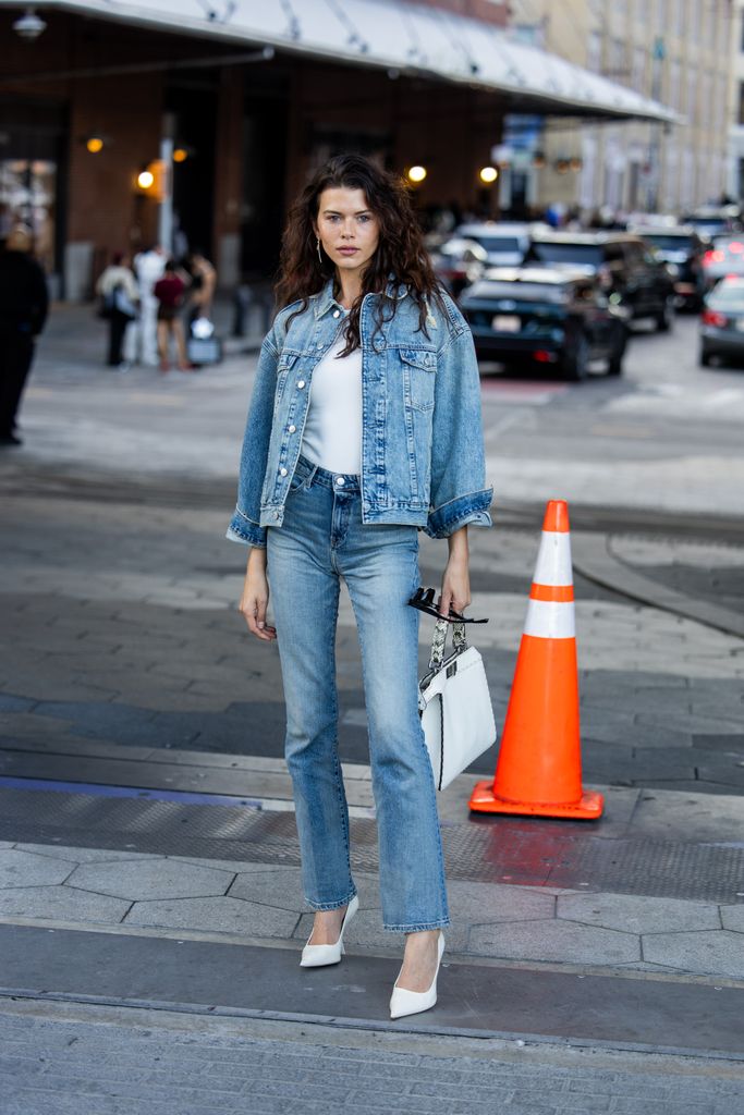 Georgia Fowler wears denim jacket, jeans outside Tommy Hilfiger New York Fashion Week on September 08, 2024 in New York City.