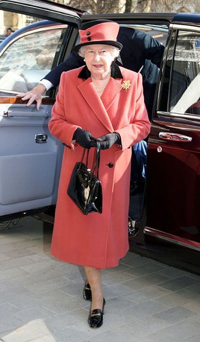 the queen wearing coral