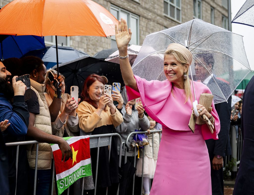 Queen Maxima greets the public upon arrival at the De Ruimte community center in Almere