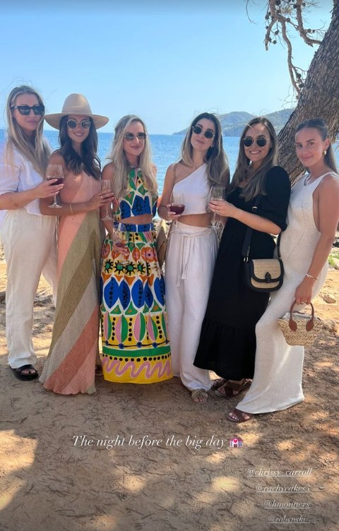 Michelle Keegan poses with friends in Ibiza in front of ocean view