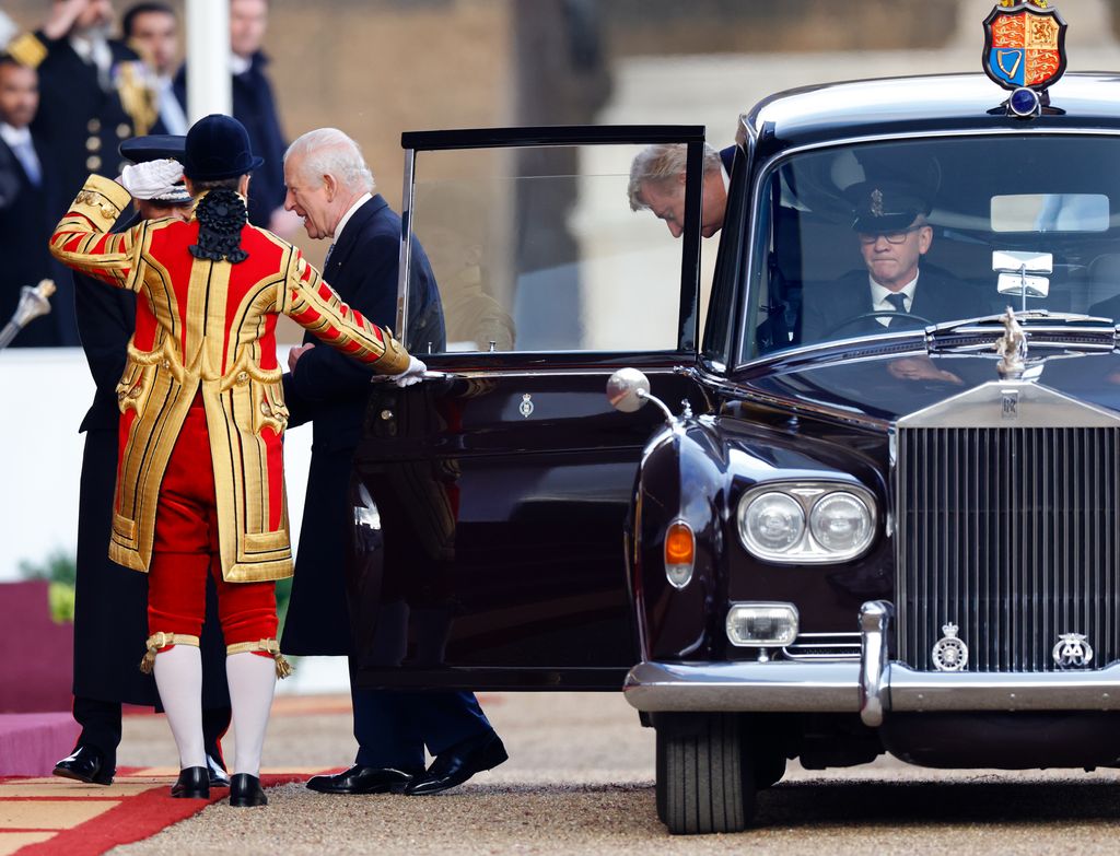 king charles exiting car 
