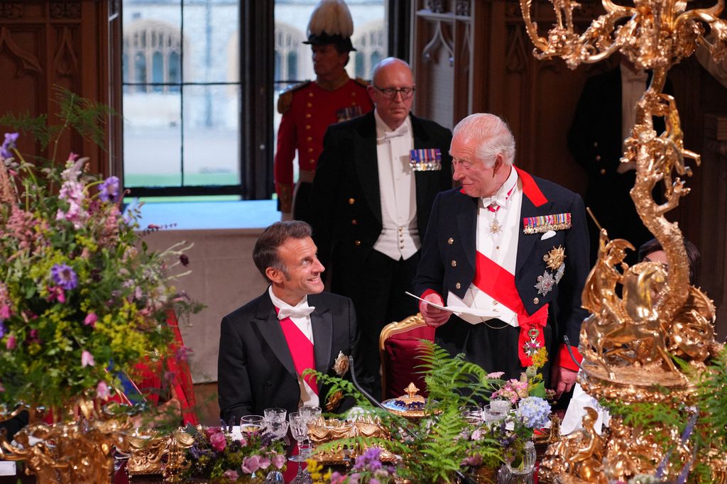 President Macron smiling at King Charles during speech