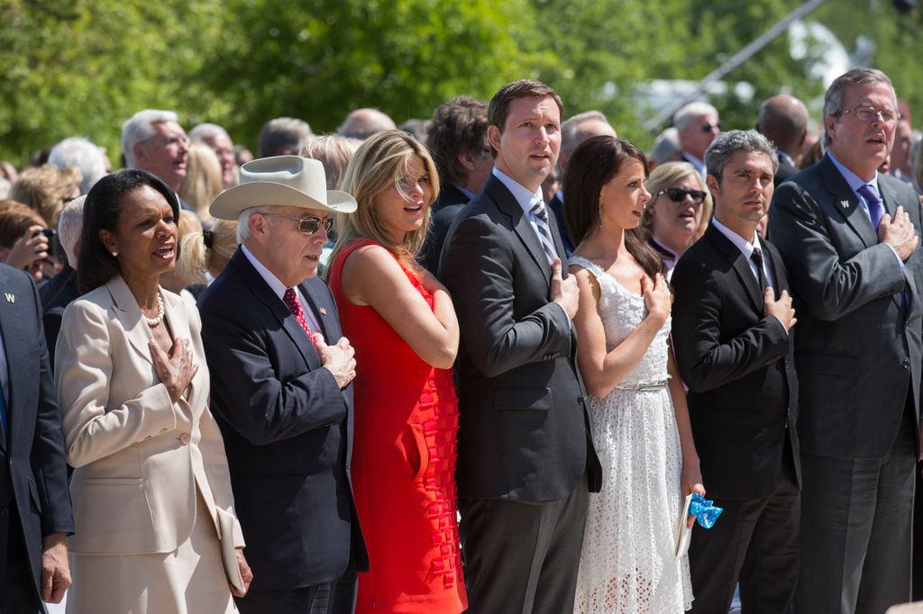 Family and former administration members sing God Bless America at the dedication of the George W. Bush presidential library on the campus of Southern Methodist University in Dallas. From the left are former U.S. Secretary of State Condoleezza Rice, former Vice President Dick Cheney, Jenna Bush Hager, Henry Hager Barbara Bush, Miky Fabrega and Jeb Bush, 2013