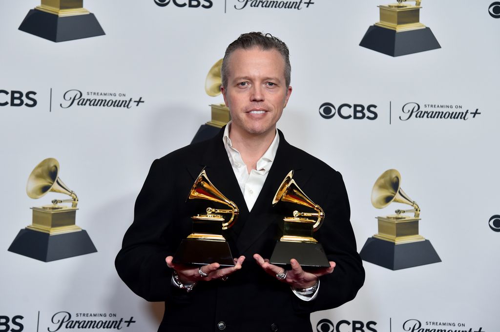 Jason Isbell, winner of the "Best Americana Album" award for "Weathervanes" and "Best American Roots Song" award for "Cast Iron Skillet,poses in the press room during the 66th GRAMMY Awards