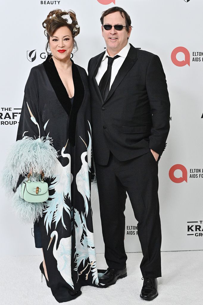 Jennifer Tilly and Phil Laak attend the Elton John AIDS Foundation's 33rd Annual Academy Awards Viewing Party on March 02, 2025 in West Hollywood, California