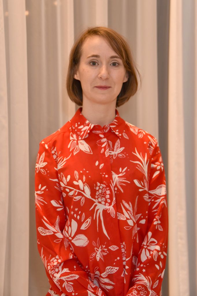 Bryony Hannah in red patterned shirt at tv event