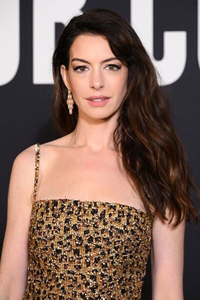 Anne Hathaway steps out in micro mini-dress and matching sheer leopard  tights for Paris Fashion week - see photos