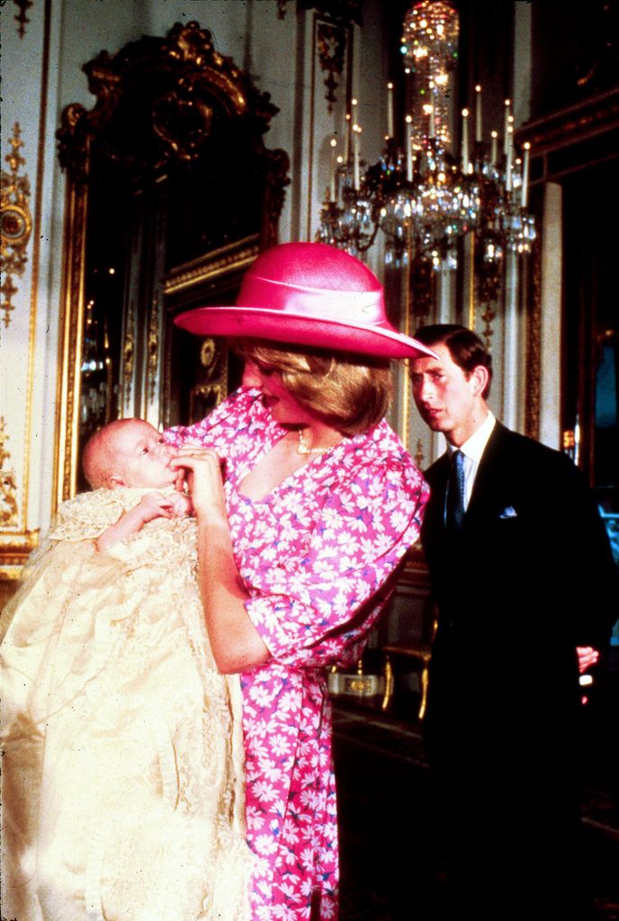 Diana and Prince Charles look on lovingly at baby Prince William on the day of his Christening 