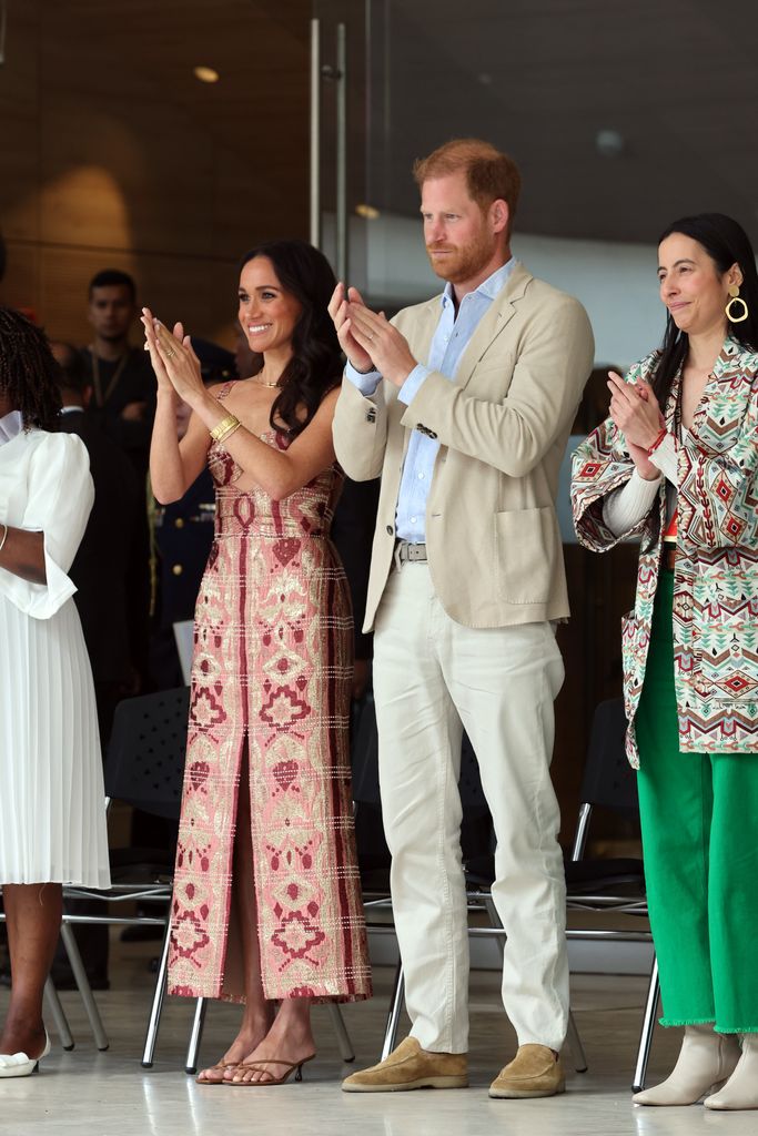 Meghan and Harry clapping 