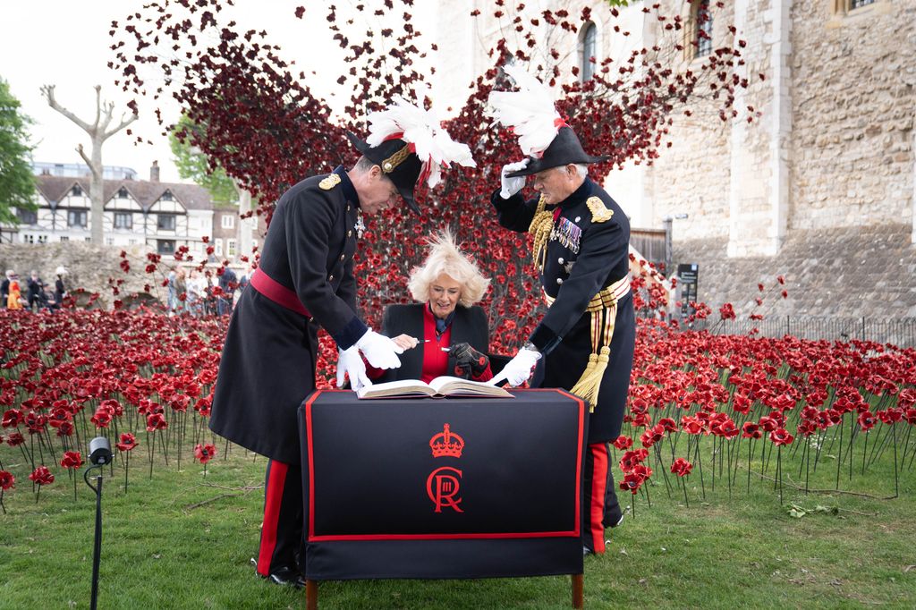 Queen Camilla signing visitors book at Tower of London
