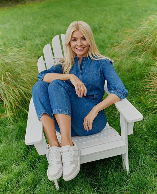 holly willoughby in denim jumpsuit and white trainers 
