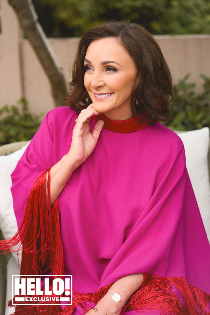 shirley ballas in pink and red smiling 