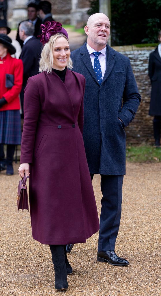 Zara Tindall in burgundy coat and Mike Tindall in suit