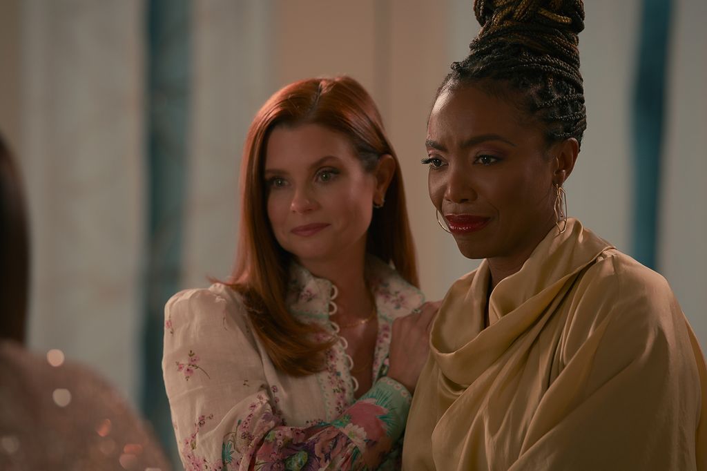 JoAnna Garcia Swisher stands next to Heather Headley in Sweet Magnolias