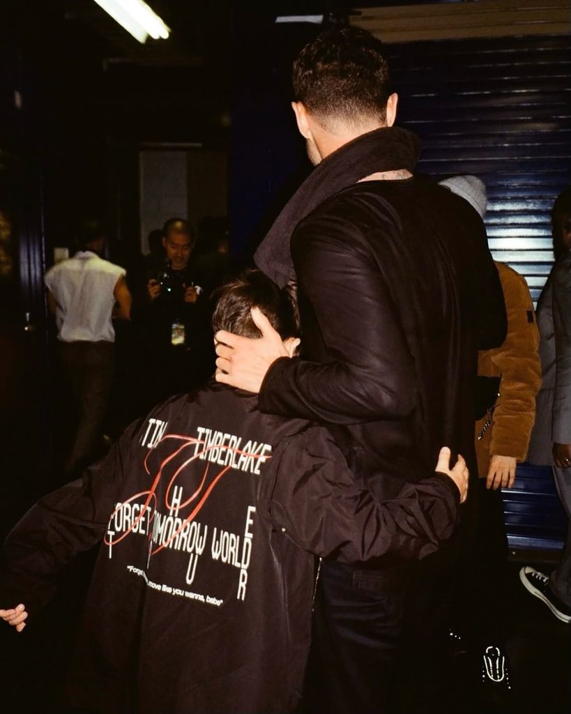 justin timberlake hugging son with backs to the camera