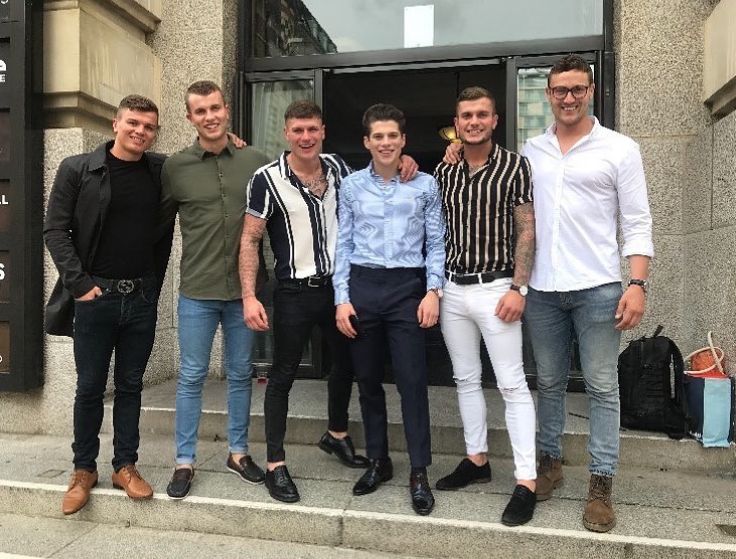 Lewis Cope standing with five of his brothers