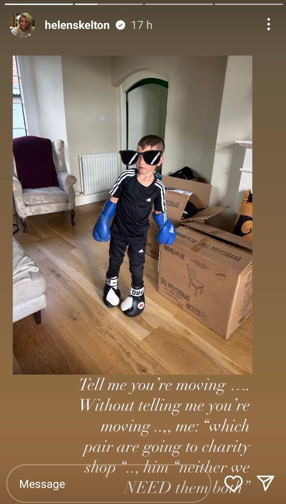 boy standing in room wearing boxing gloves