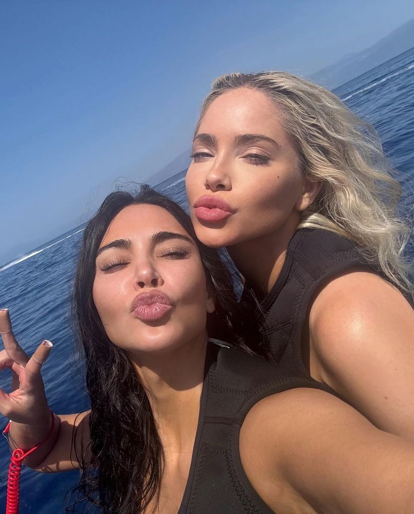 Kim poses with a pal aboard a jetski