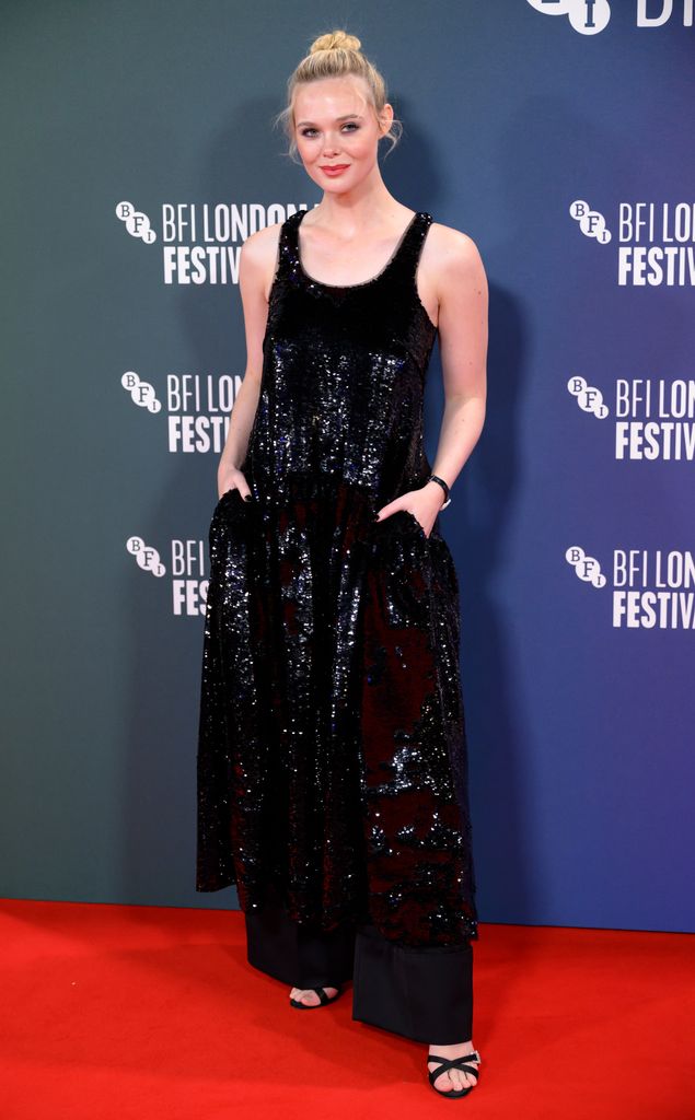 Elle Fanning on red carpet in black sequin jumpsuit