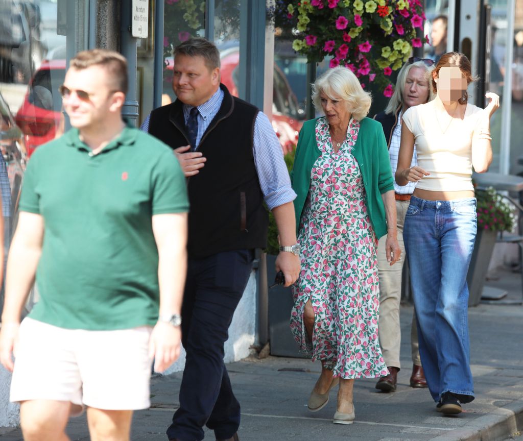 Queen Camilla in floral dress shopping with Eliza Lopes in Ballater