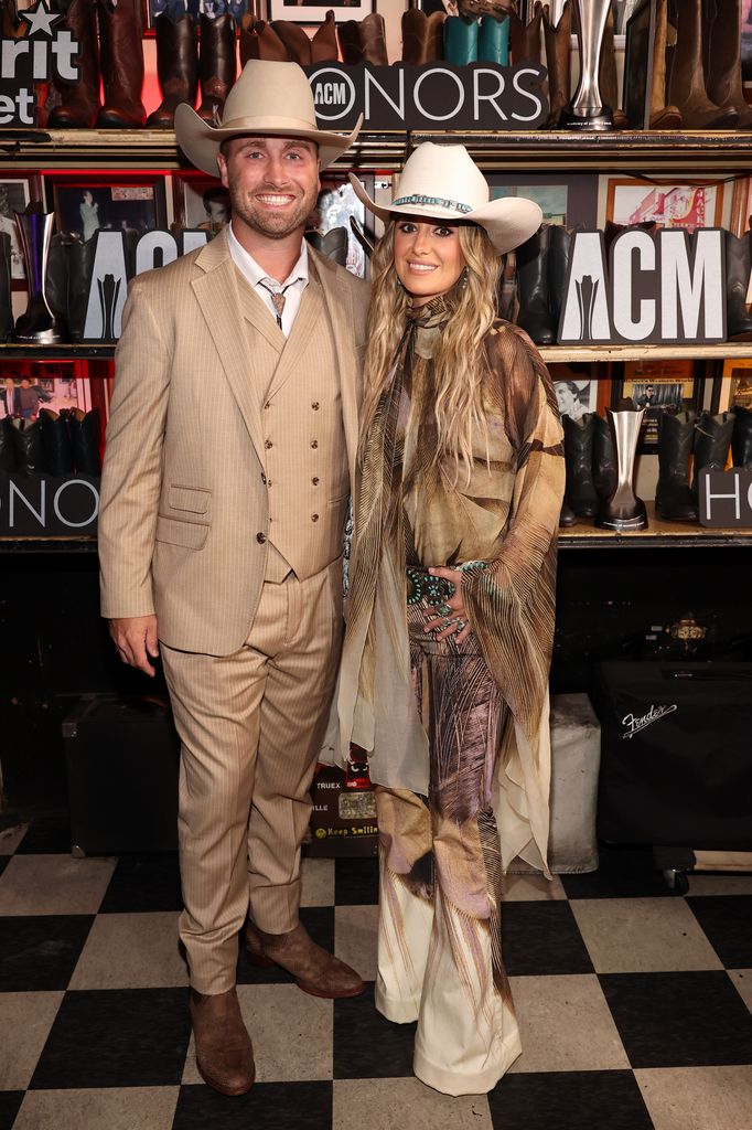 lainey wilson and duck hodges in cowboy hats