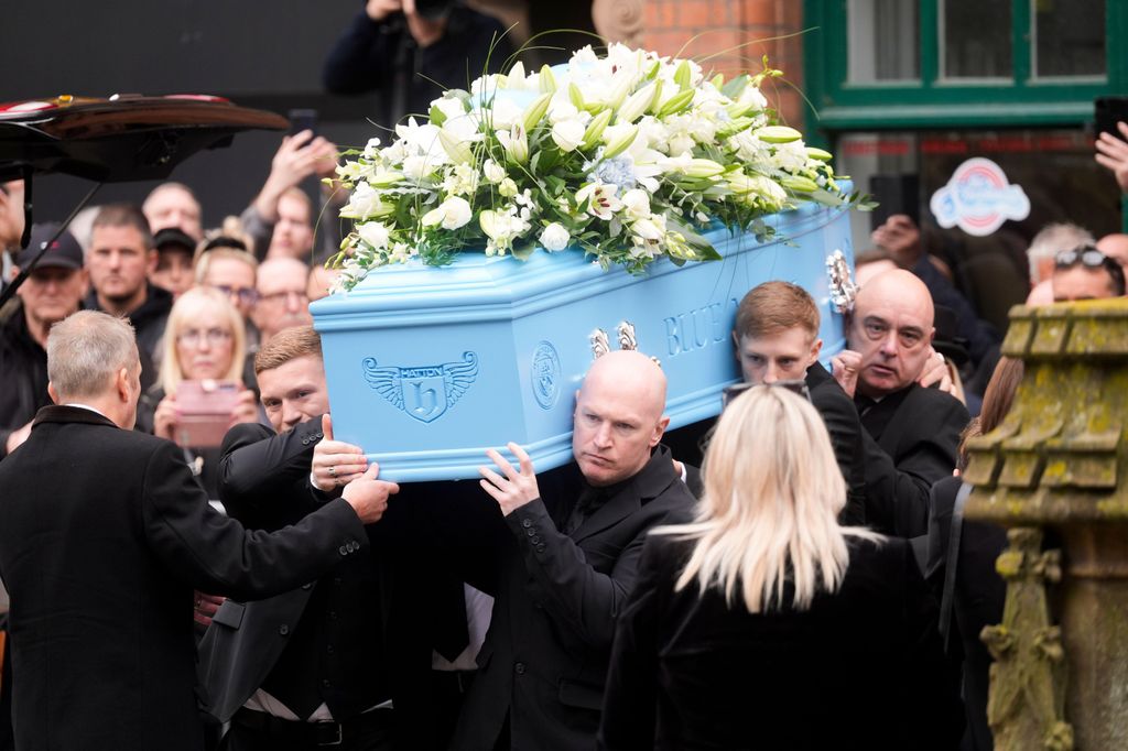 Ricky Hatton's coffin is carried into Manchester Cathedral. 