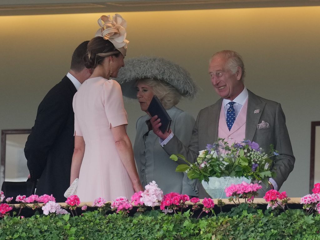 King Charles and Harriet Sperling chatting as Ascot