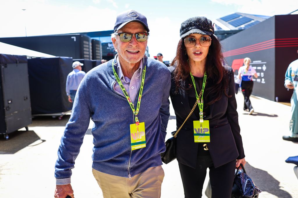 couple walking together at motor racing event