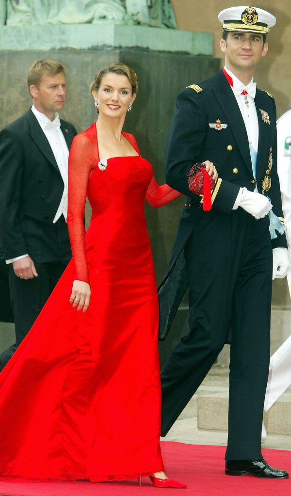 Letizia was pictured in a red wedding guest dress with her fiance at Copenhagen Cathedral 