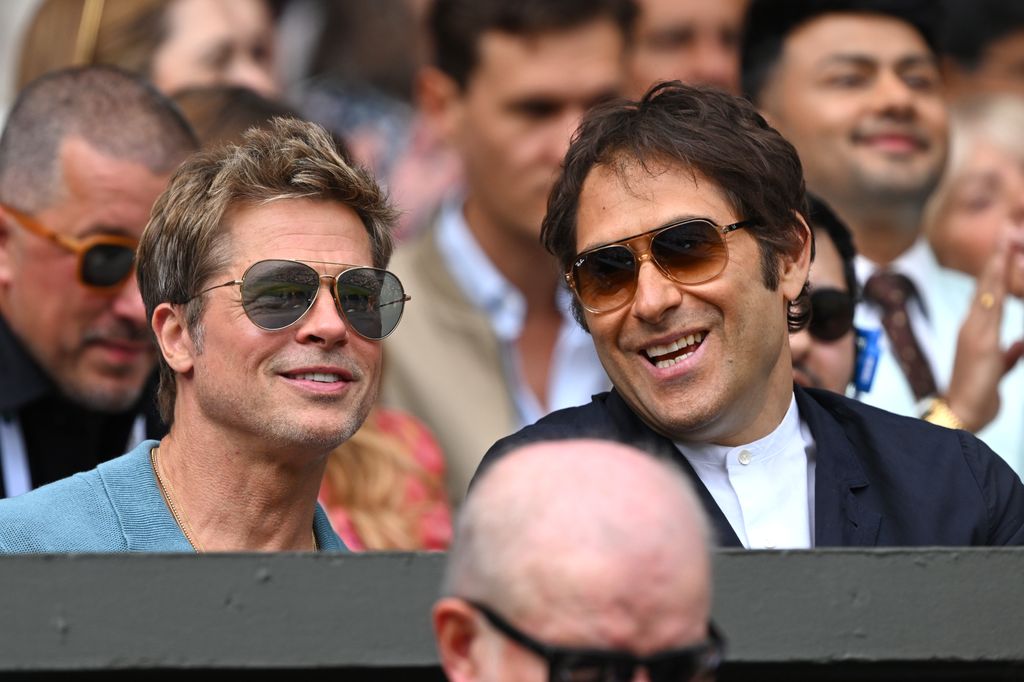 Brad Pitt and Jeremy Kleiner watch Carlos Alcaraz vs Novak Djokovic in the Wimbledon 2023 men's final on Centre Court during day fourteen of the Wimbledon Tennis Championships at the All England Lawn Tennis and Croquet Club on July 16, 2023 in London, England. 