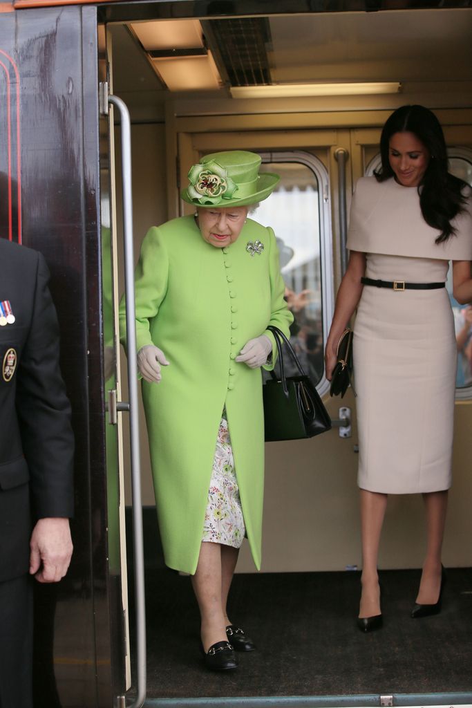 Queen Elizabeth II and Meghan, Duchess of Sussex arrive by Royal Train at Runcorn Station to open the new Mersey Gateway Bridge on June 14, 2018 in the town of Runcorn, Cheshire, England.