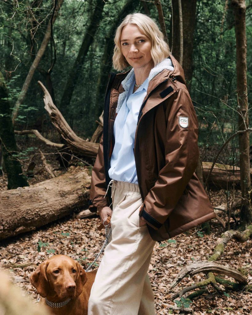 Jodie Kidd taking dog for walk in woods