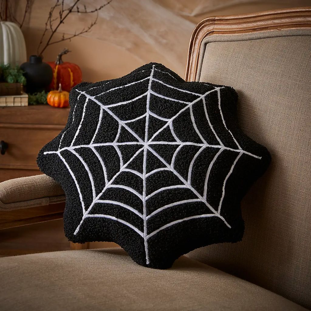 Dunelm Web shaped cushion