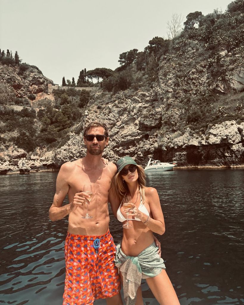 Abbey Clancy and Peter Crouch in swimwear on a boat