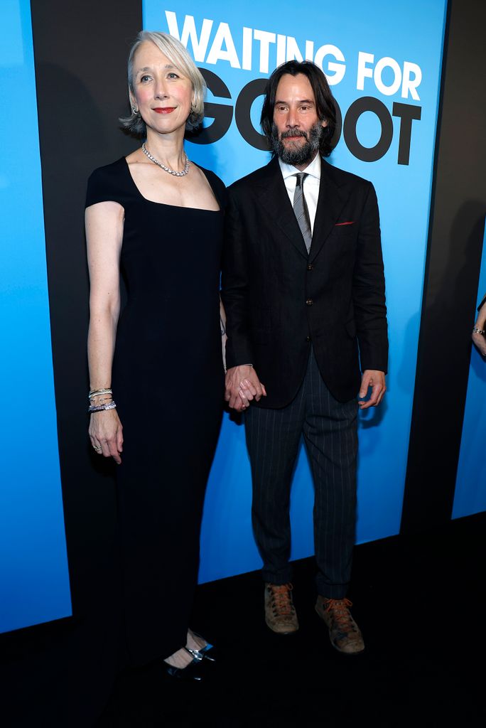 Keanu and Alexandra hand in hand