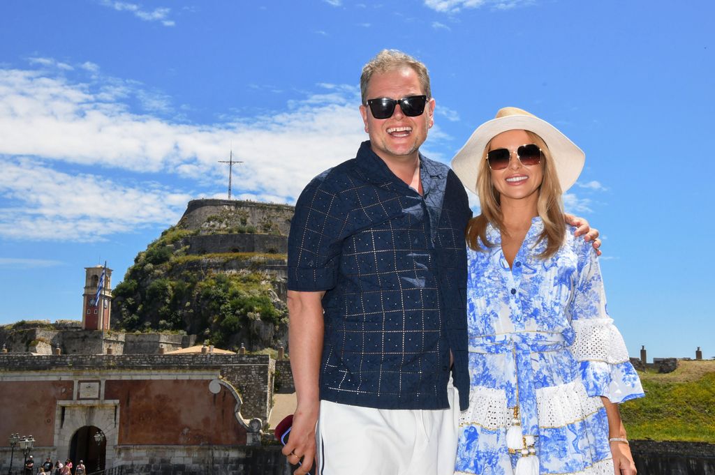 Amanda Holden wearing a blue and white floral dress on Amanda & Alan's Greek Job