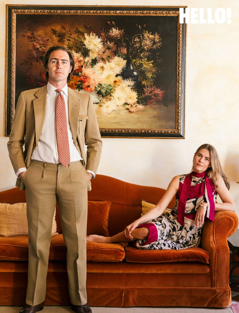 The couple in one of their living rooms, which features warm Tuscan colours at Villa Talamo