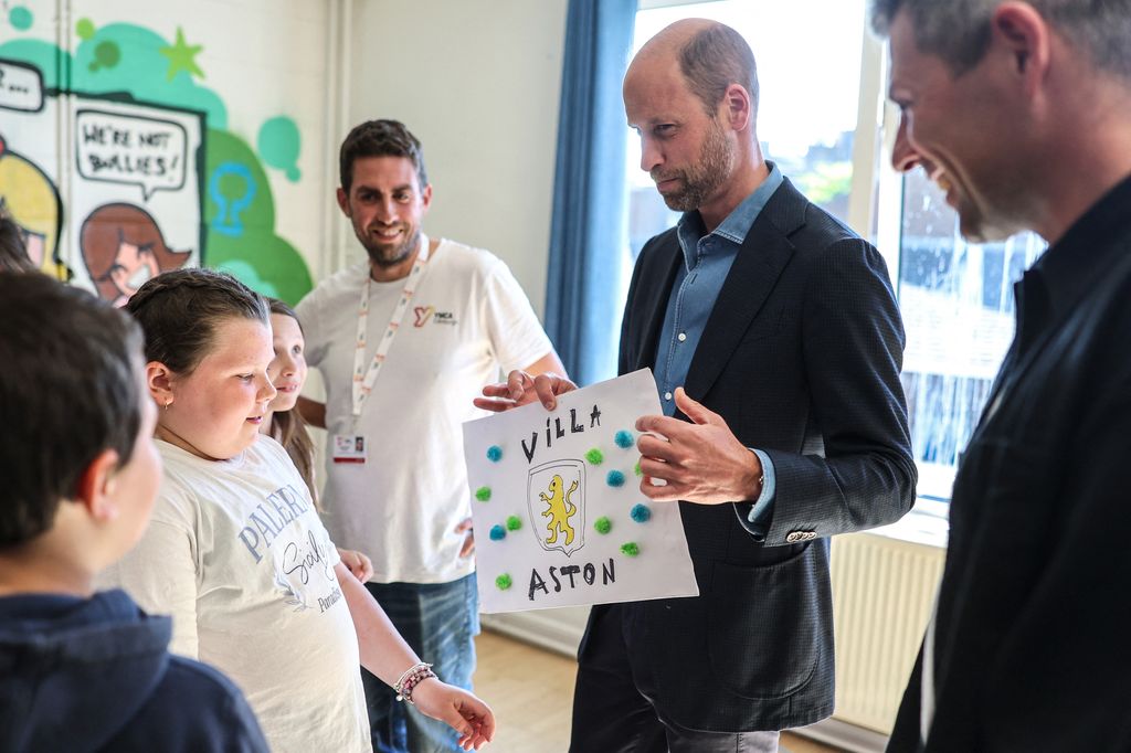 Prince William chatted to young guests at the Edinburgh YMCA's Youth Forum with Street Soccer Scotland at Leith Community Centre, in Leith, Scotland
