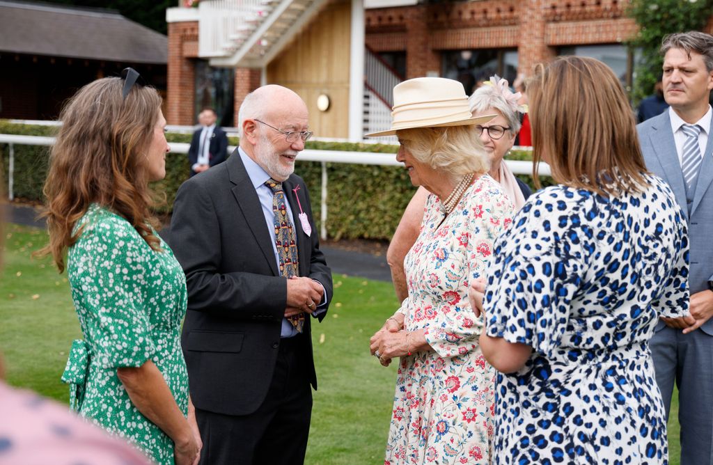 Queen Camilla talking to group of people